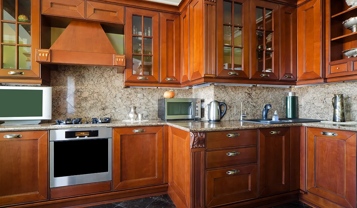 Updated cabinetry and countertops in kitchen remodel.